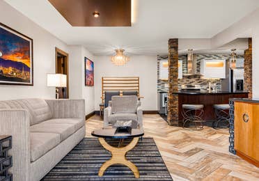 Elegant suite with designer furnishings and a modern open kitchen.