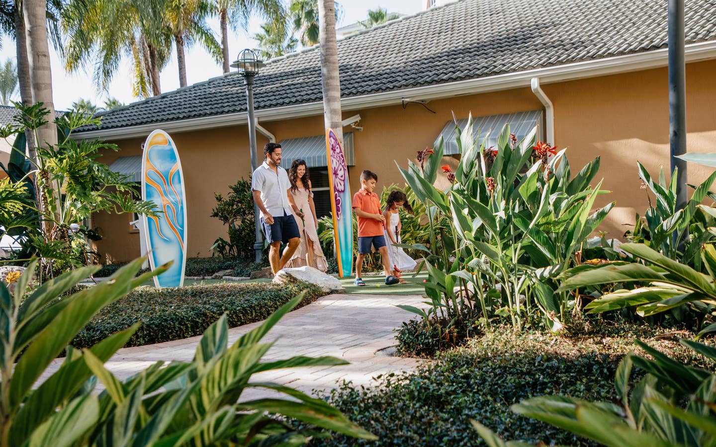 Family walking around property at Cape Canaveral Beach Resort in Florida.