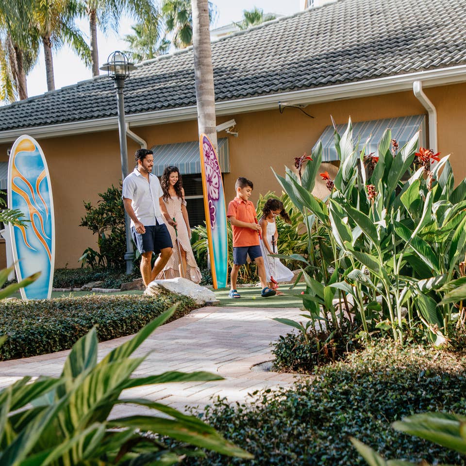 Family walking around property at Cape Canaveral Beach Resort in Florida.