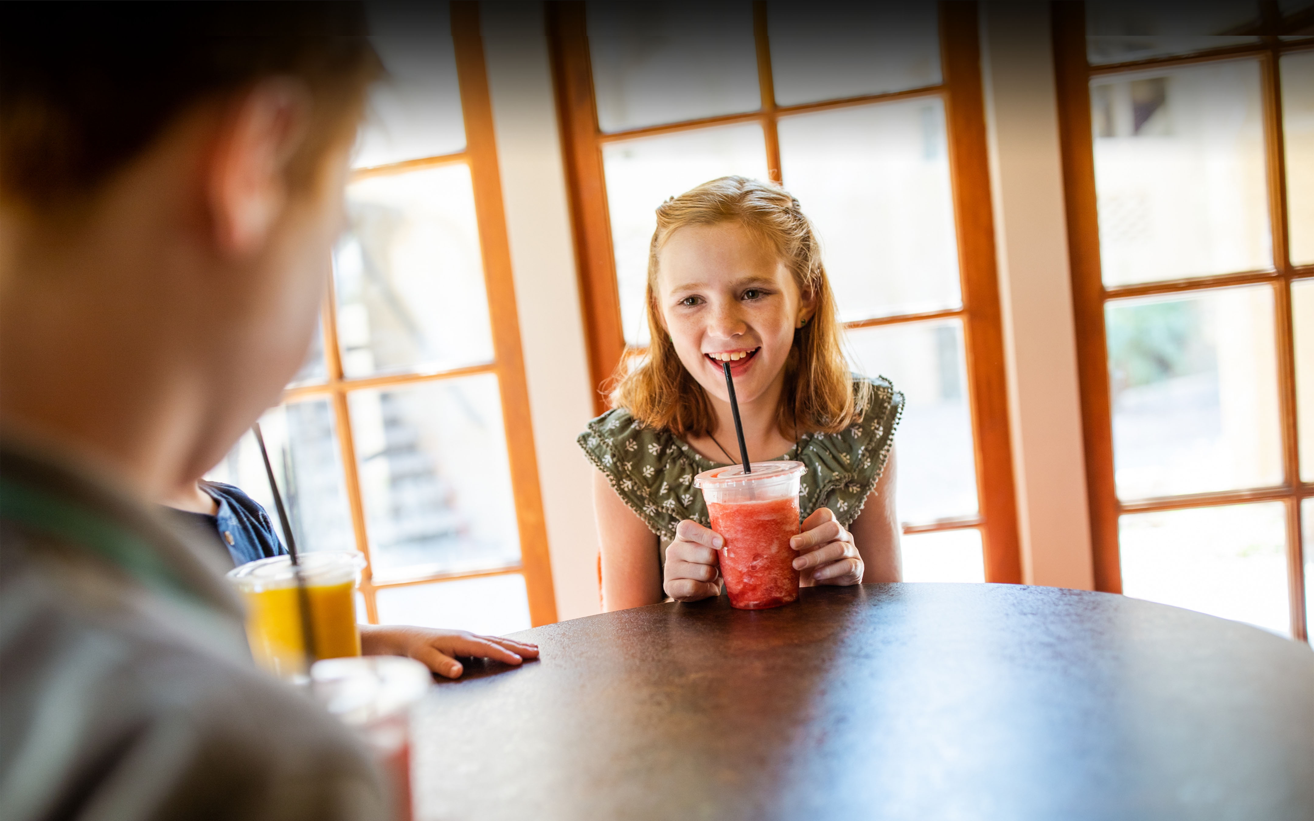 Child enjoying an icee beverage at Galveston Seaside Resort.