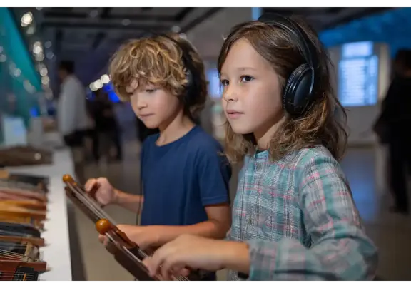 Kids playing world instruments at Musical Instrument Museum Scottsdale.