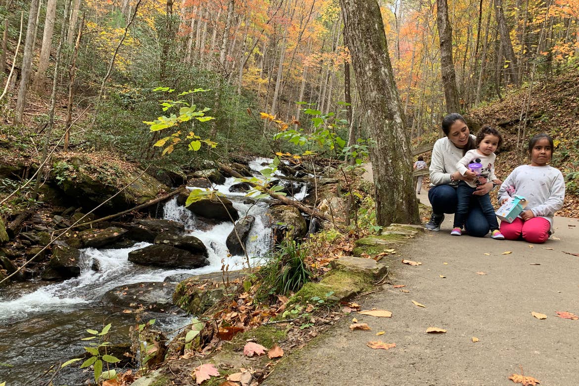 Featured author, Andrea Beltran, sister (left) poses with her two nieces (middle and right) near Anna Ruby Falls waterfall.