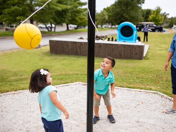 Two children playing tetherball at Holiday Hills Resort in Branson, Missouri.