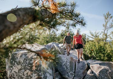 Couple hiking at Monument Mountain near Oak n' Spruce Resort in South Lee, Massachusetts.