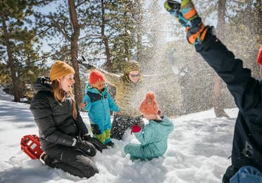 Andrea Rassmussen and her family take a break to play in the snow.