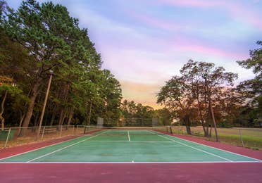 Outdoor tennis court at Lake O' the Wood Resort in Flint, Texas.