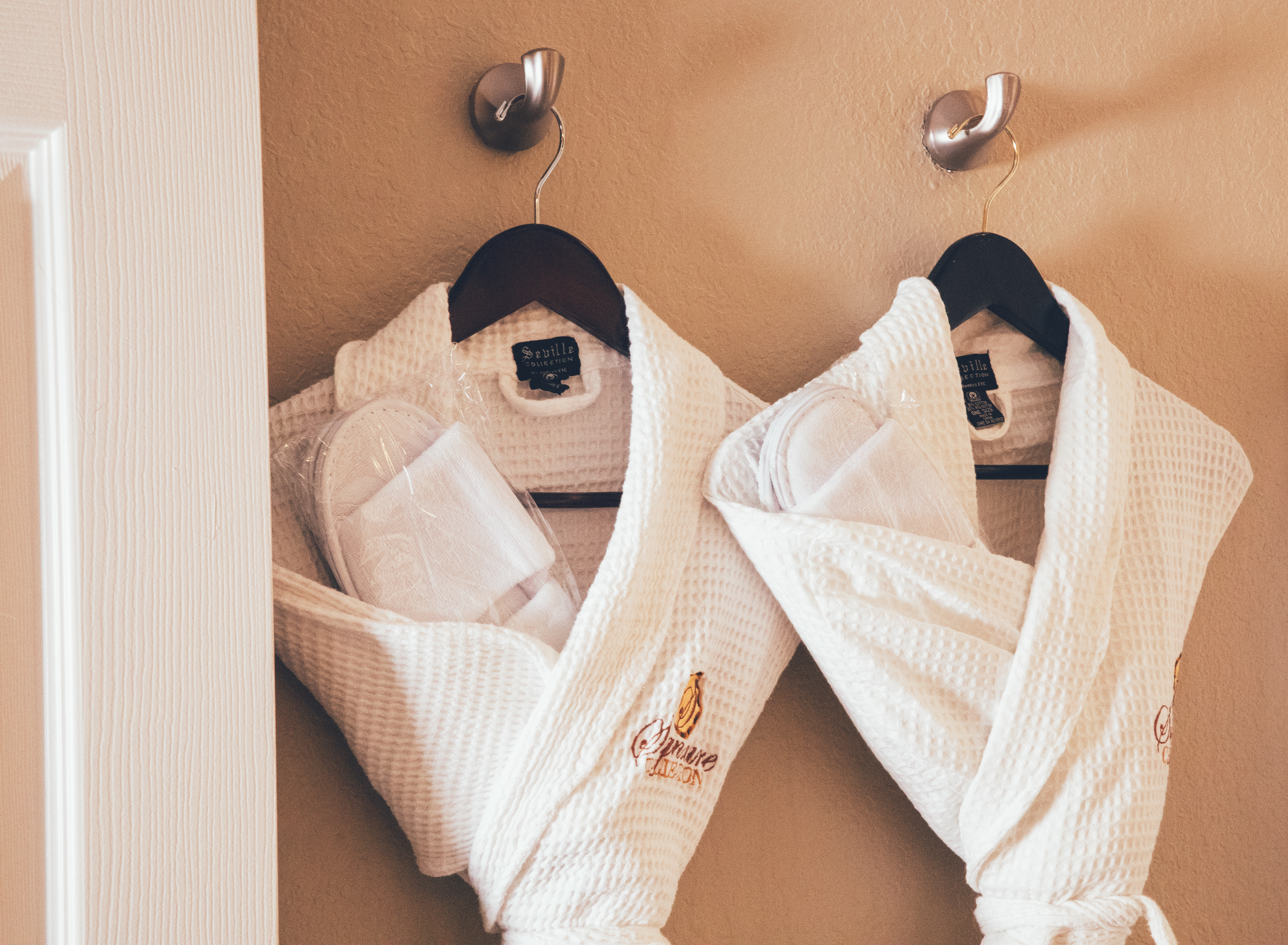 Closeup of white complimentary robes in a Signature villa in River Island at Orange Lake Resort near Orlando, Florida