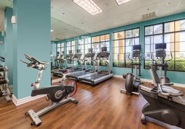 Fitness center with treadmills and elliptical machines at Sunset Cove Resort in Marco Island, Florida.