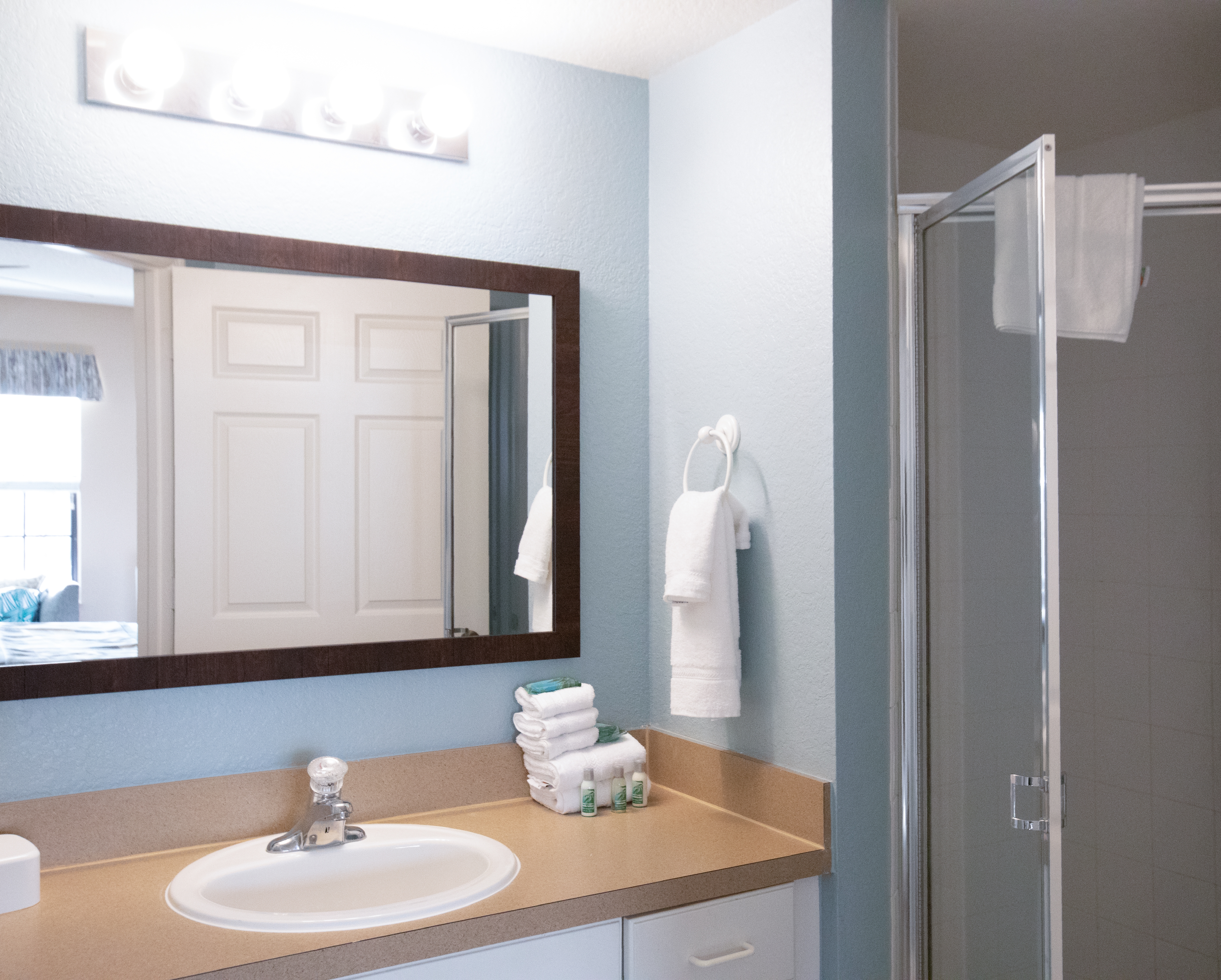Bathroom with walk-in shower in a villa in East Village at Orange Lake Resort near Orlando, Florida