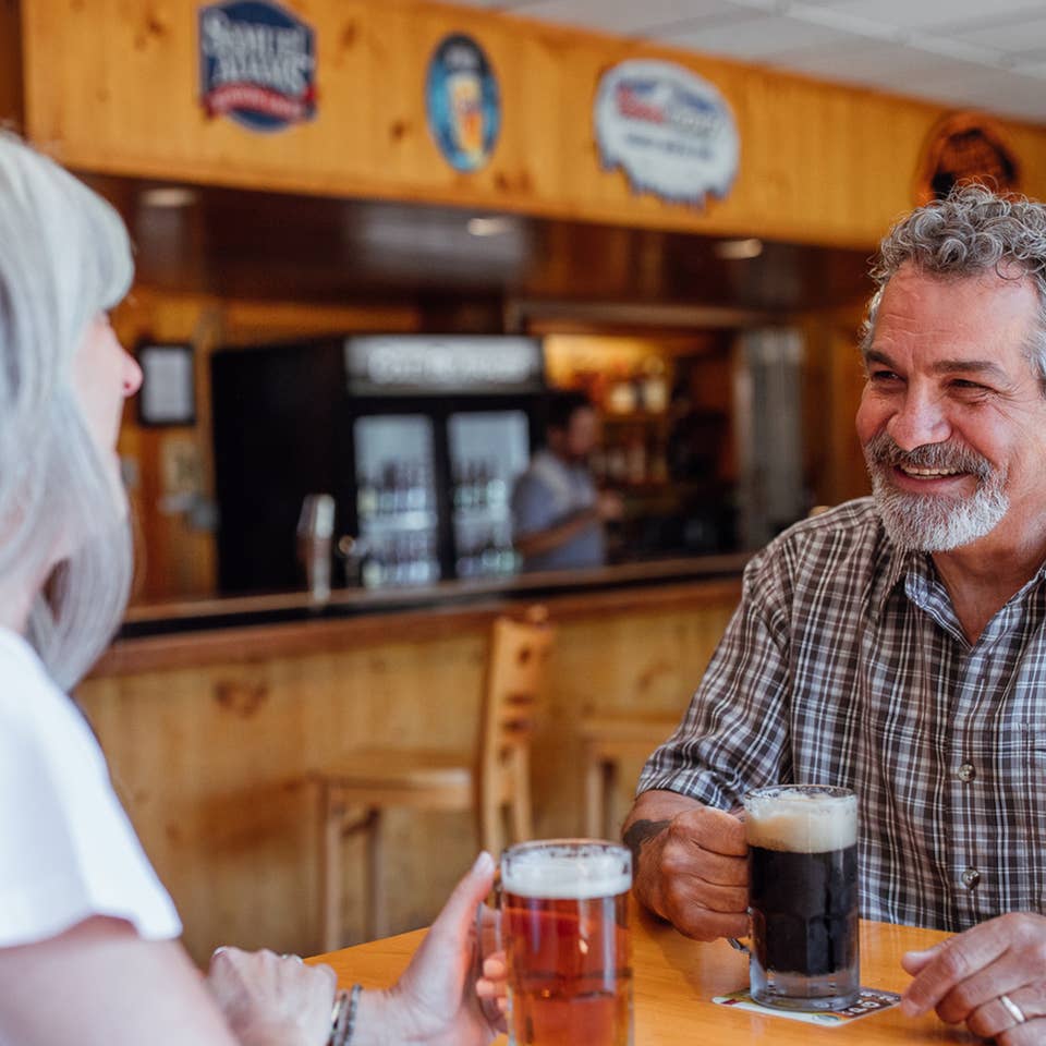 Couple having drinks at Beartree Bar at Oak n' Spruce Resort in South Lee, Massachusetts.