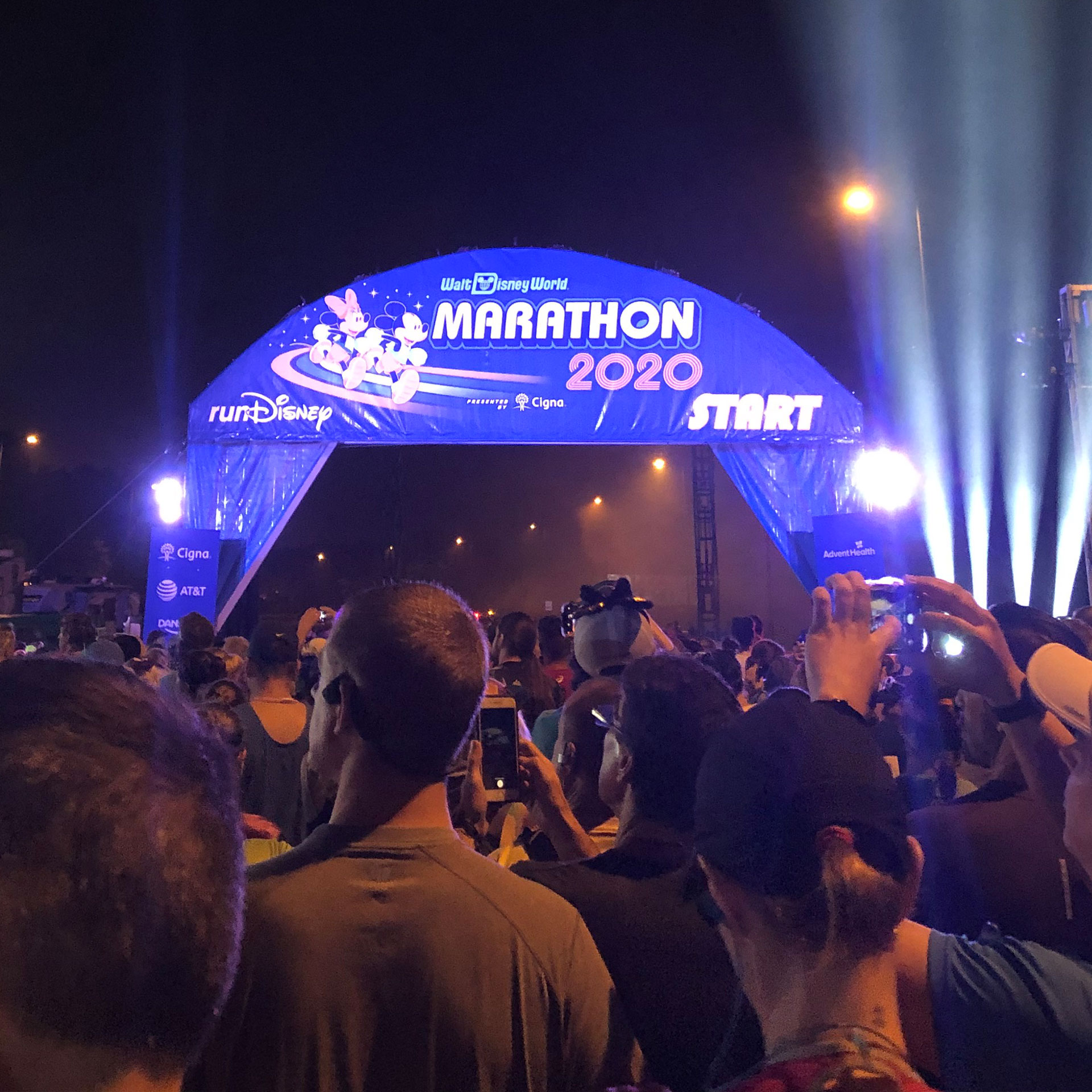 A blue starting line sign with Mickey and Minnie Mouse that reads, 'Walt Disney World Half Marathon 2020, Start.'