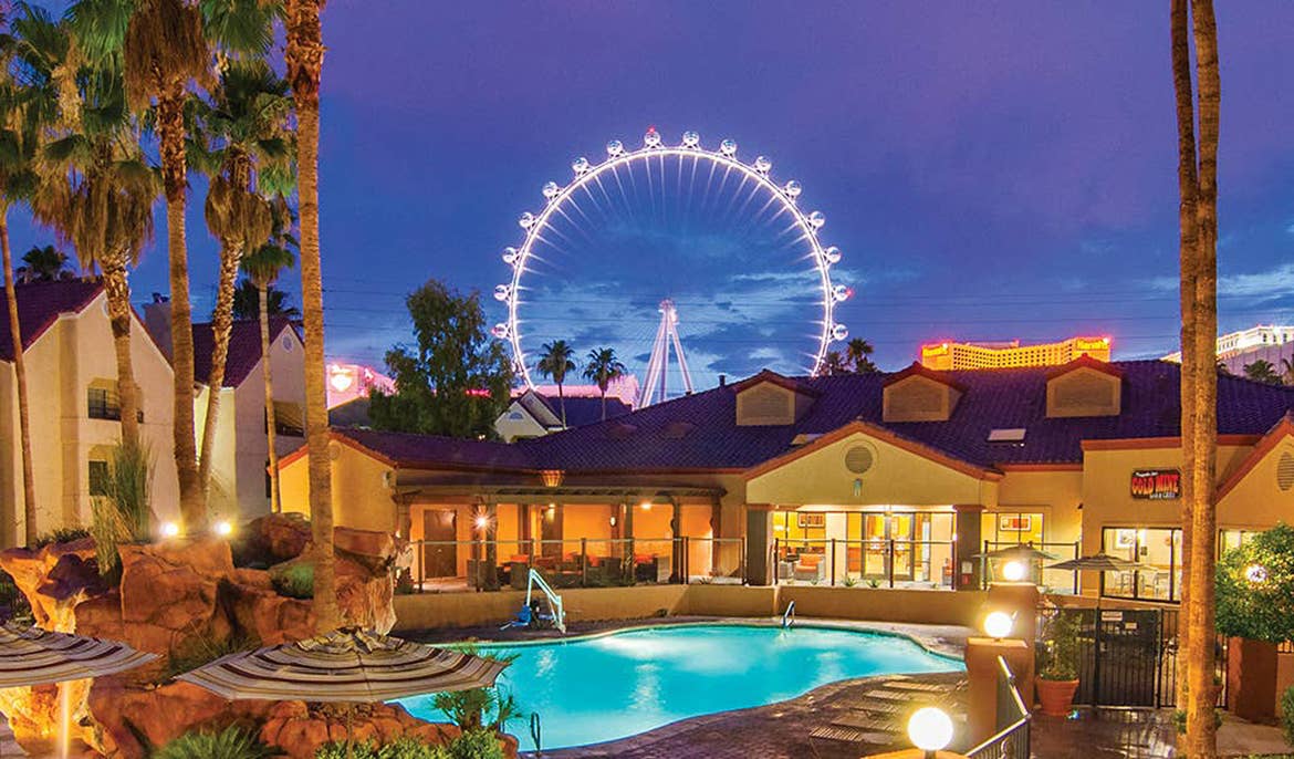 Pool at Desert Club Resort in Las Vegas with the 'High Roller' ferris wheel in the background.