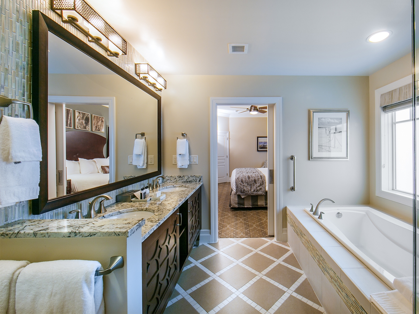 Bathroom with a bath and double vanity in a three-bedroom Signature Collection villa at South Beach Resort in Myrtle Beach, South Carolina.