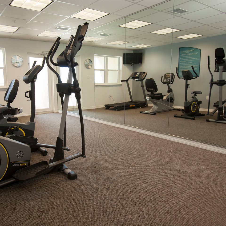 Fitness center with treadmills, stationary bicycles and ellipticals at Panama City Beach Resort in Florida.