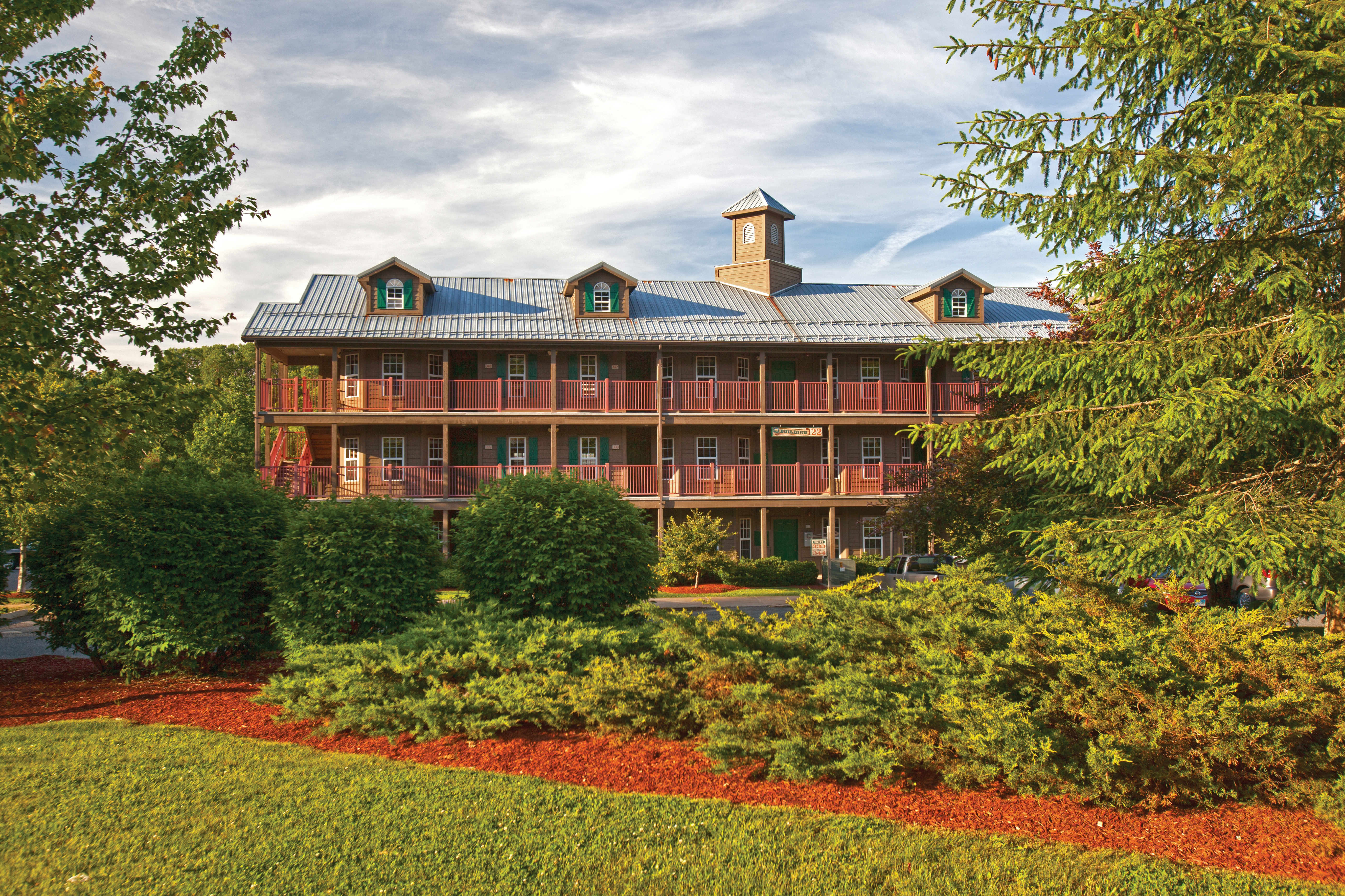 Oak n' Spruce Resort in South Lee, Massachusetts surrounded by well-manicured landscaping