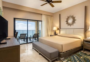 Peaceful master bedroom with ocean views and modern décor.