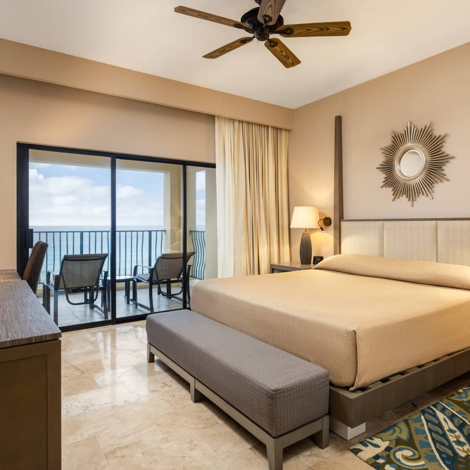 Peaceful master bedroom with ocean views and modern décor.