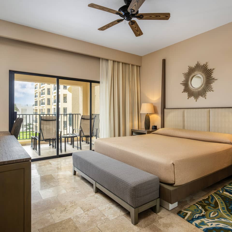 Serene oceanview bedroom with a private balcony.