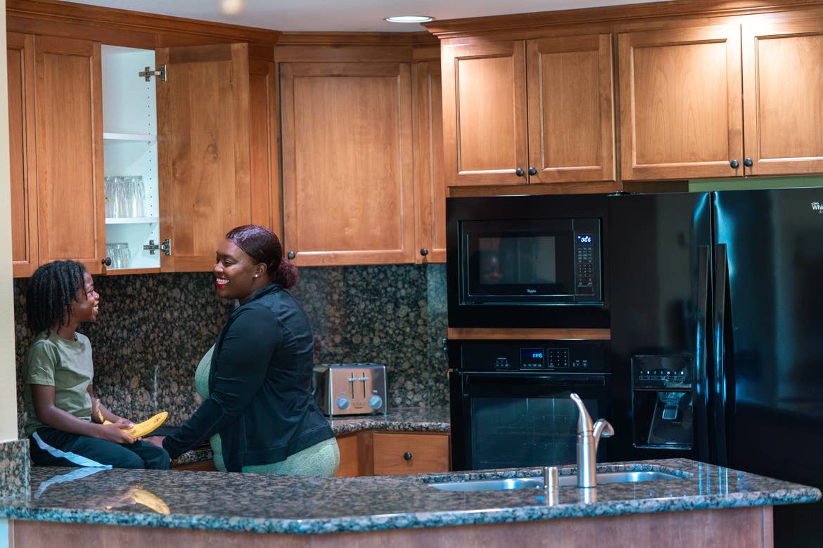 Karen and her son spending time in the kitchen of their Tahoe Ridge Resort villa.