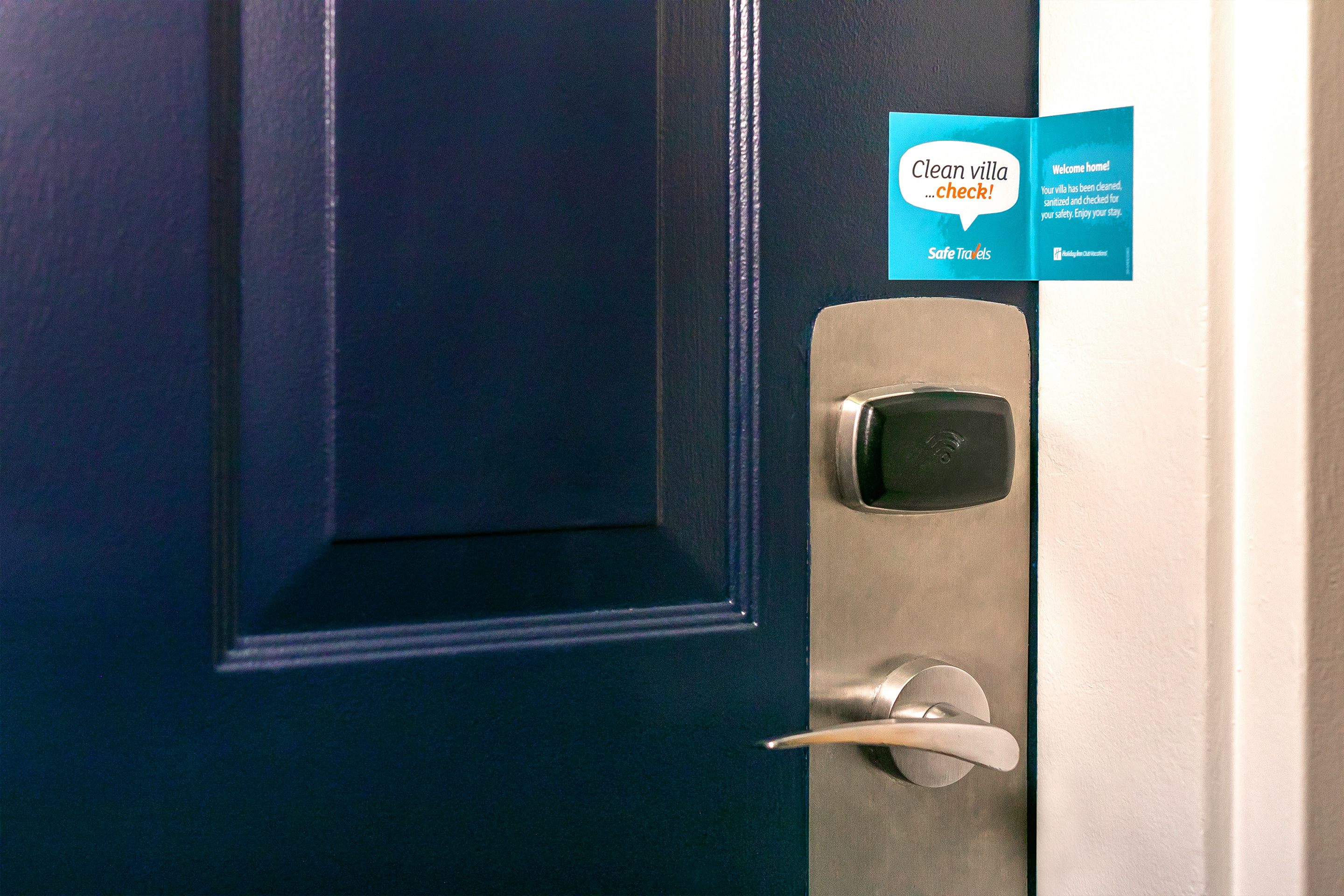 A door at Cape Canaveral Beach resort w/ a Safe Travels seal to ensure to guests that the door has been unopened since sanitization.