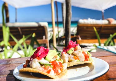 Fish tacos by the pool with beach view from Sand Dollar by the terrace at Royal Sands Resort in Cancun, Mexico