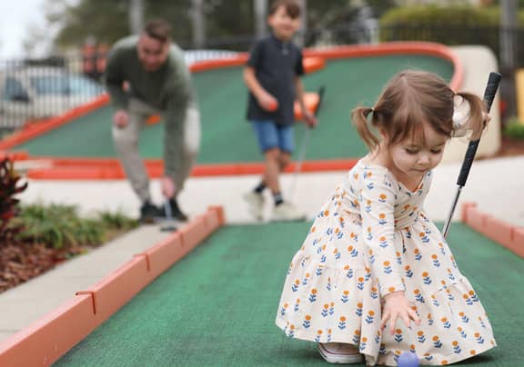 Family playing mini golf at Tahoe Ridge Resort in Stateline, NV