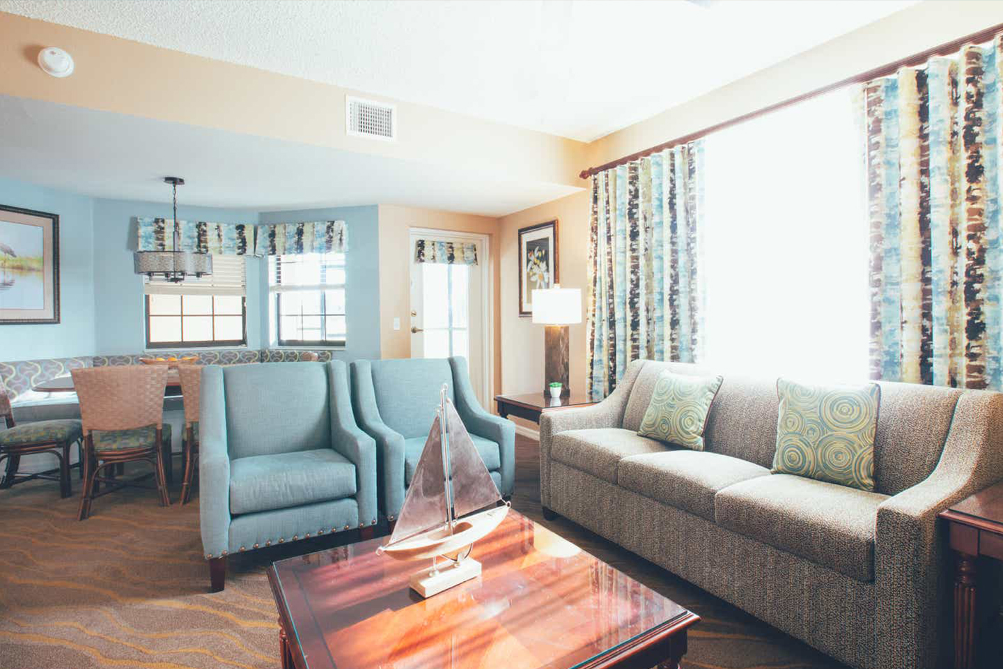 A living room in a villa at Orange Lake Resort