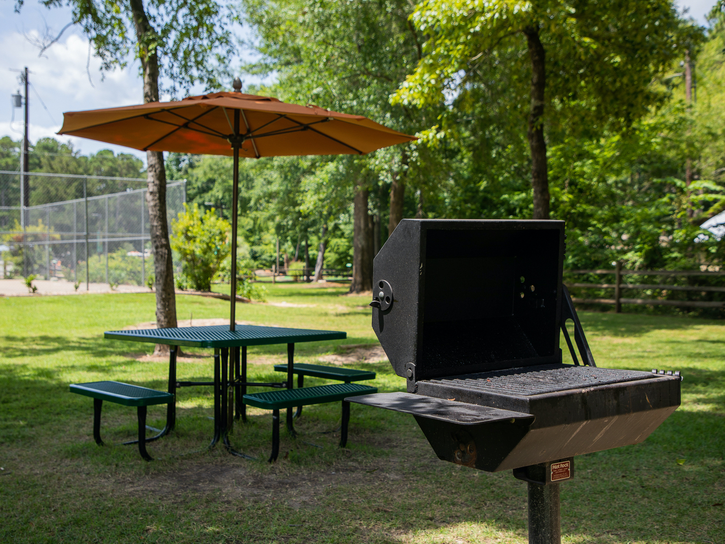 Barbecue grill and picnic table at Villages Resort in Flint, Texas.
