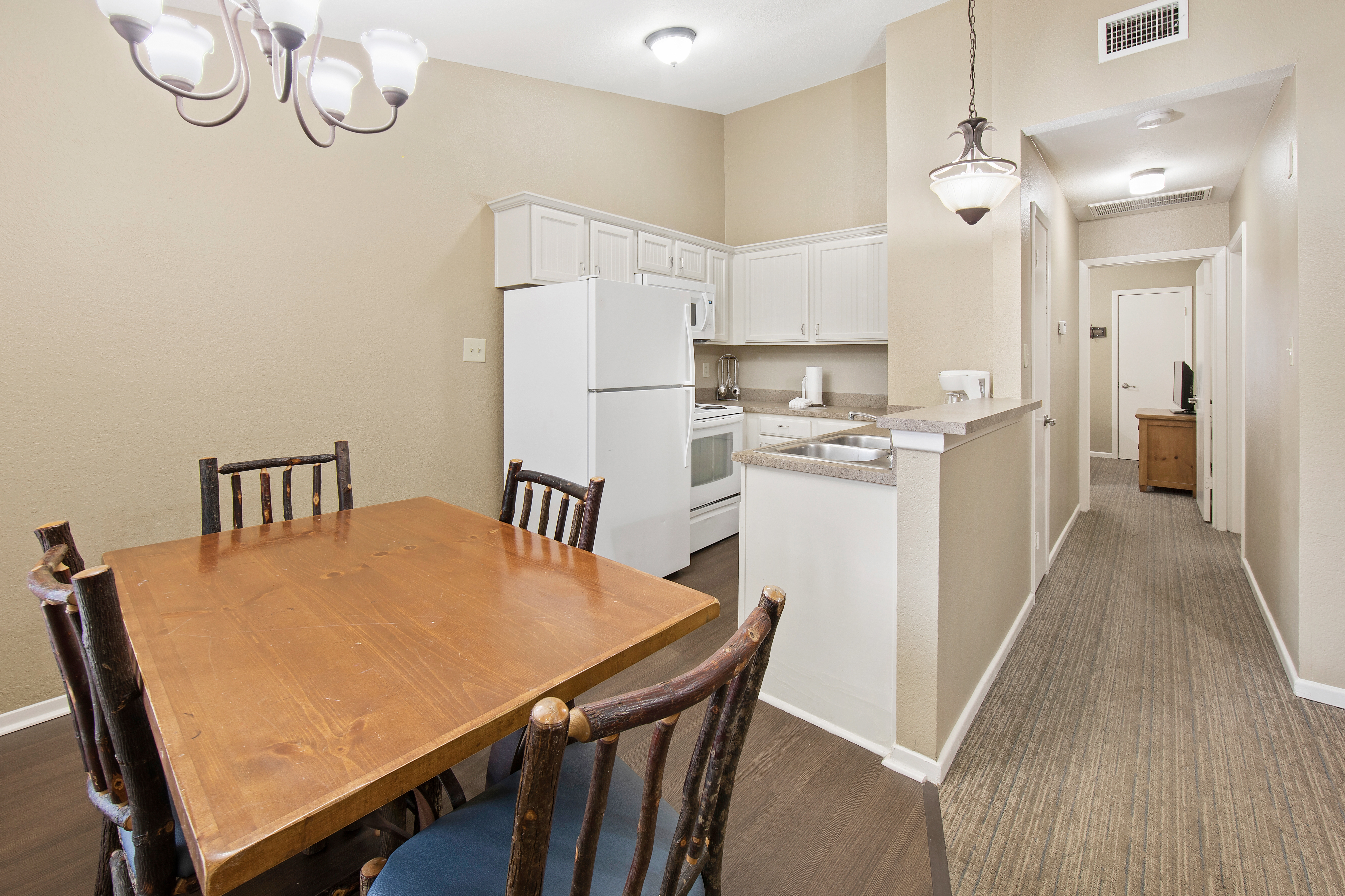 Dining room and kitchen in two-bedroom cabin at the Hill Country Resort in Canyon Lake, Texas.