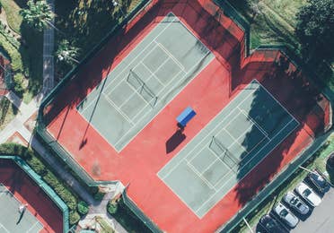 Aerial view of two outdoor tennis courts in West Village at Orange Lake Resort near Orlando, Florida