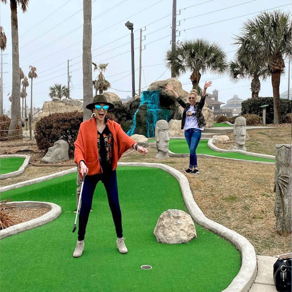 Featured Contributor, Amanda Nall (right) plays mini-golf with her friend at our Galveston Beach Resort in Galveston, Tx.