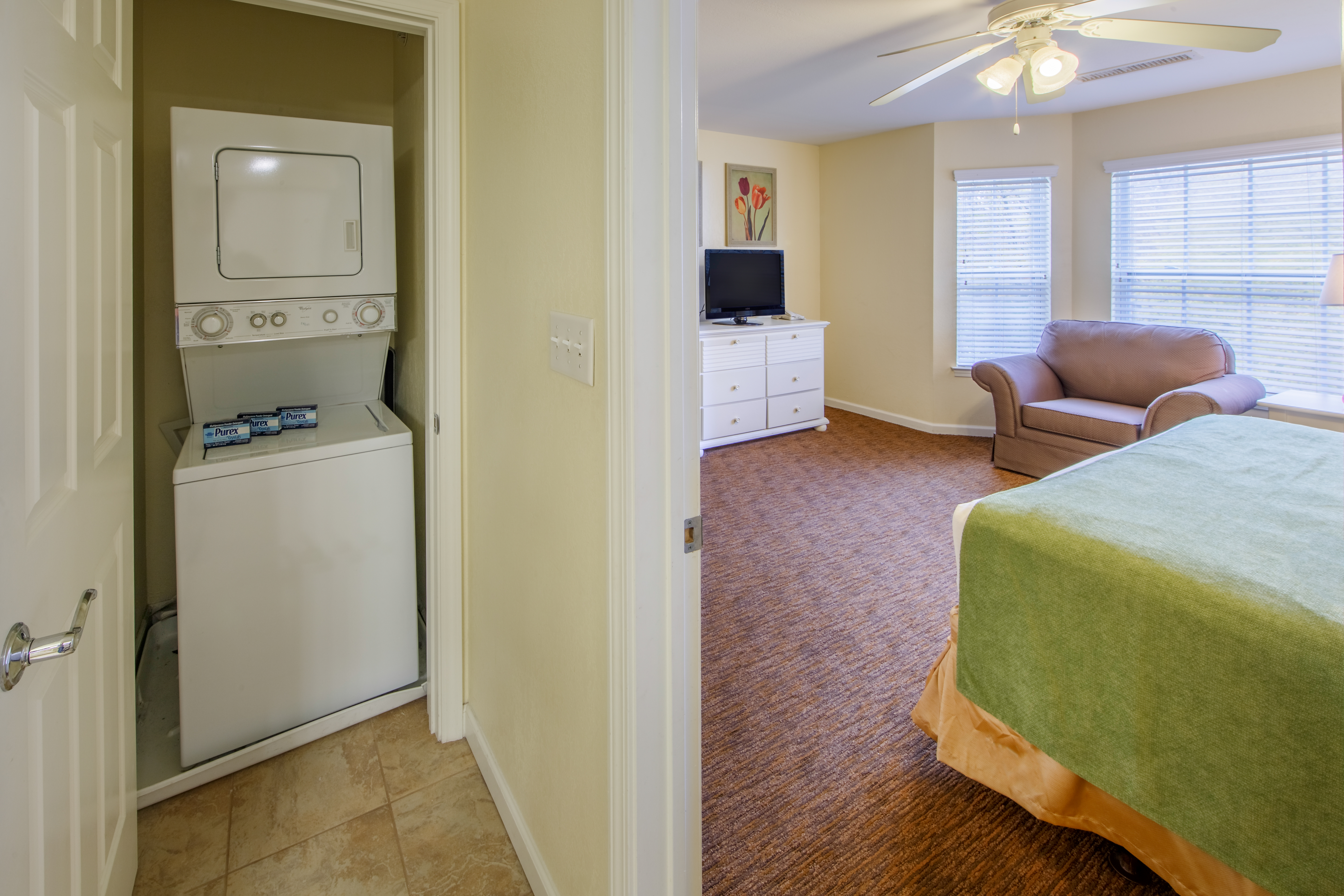 Stackable washer and dryer in a bedroom closet