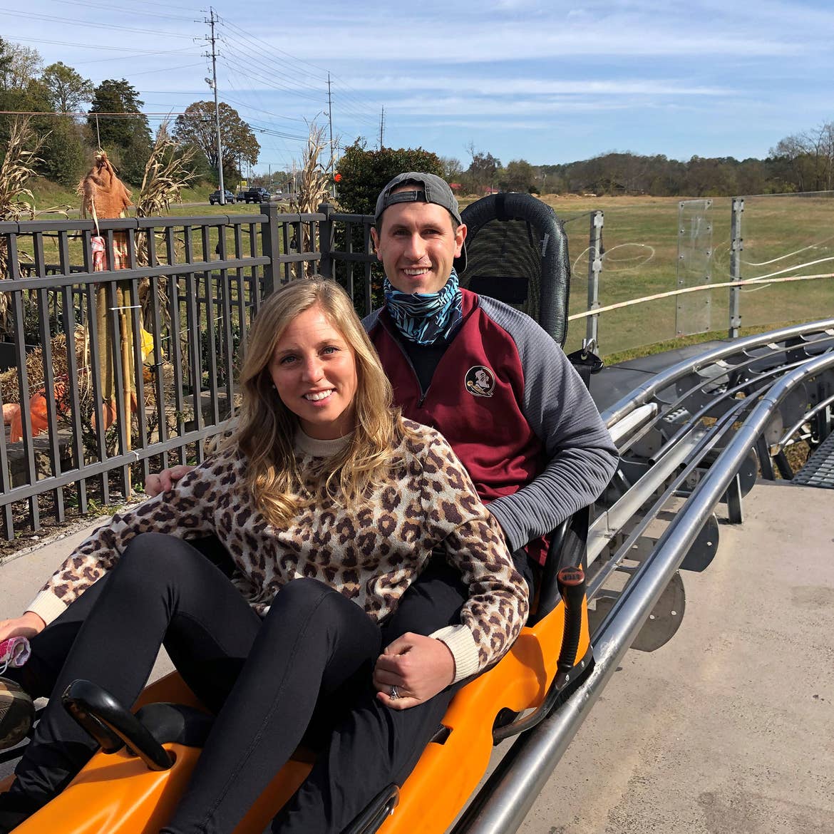 Tiffany (left) and her husband (right) seated in the Smoky Mountain Alpine Coaster in Gatlinburg, TN.