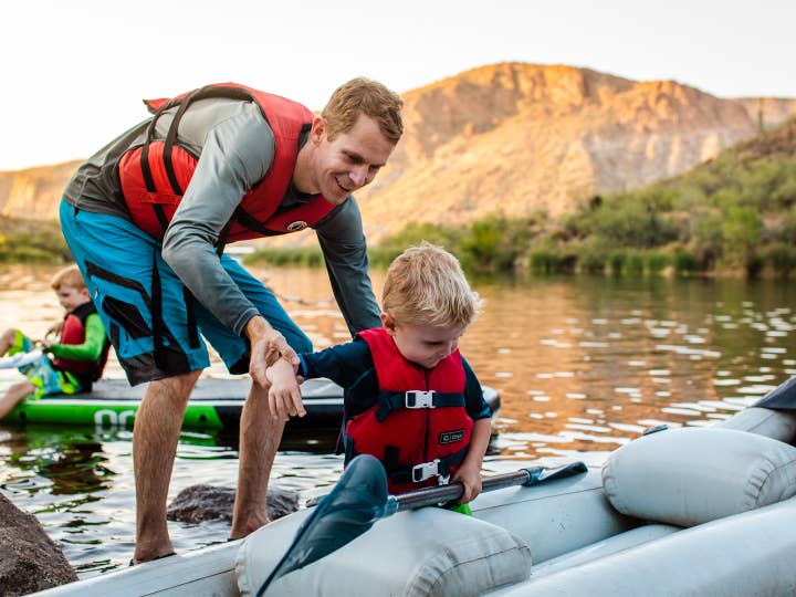 Adult and child kayaking near Scottsdale Resort.