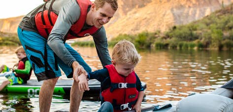 Adult and child kayaking near Scottsdale Resort.