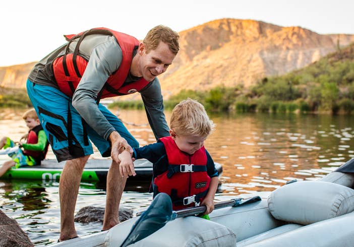 Adult and child kayaking near Scottsdale Resort.