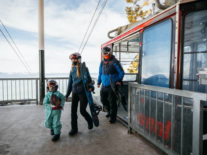 Family exiting Skier Express and heading to ski at Tahoe Ridge Resort in Stateline, Nevada.