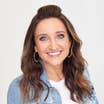 Mindy McKnight headshot in front of a white backdrop.