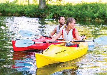 A man and woman kayaking near Orange Lake Resort in Orlando, Florida