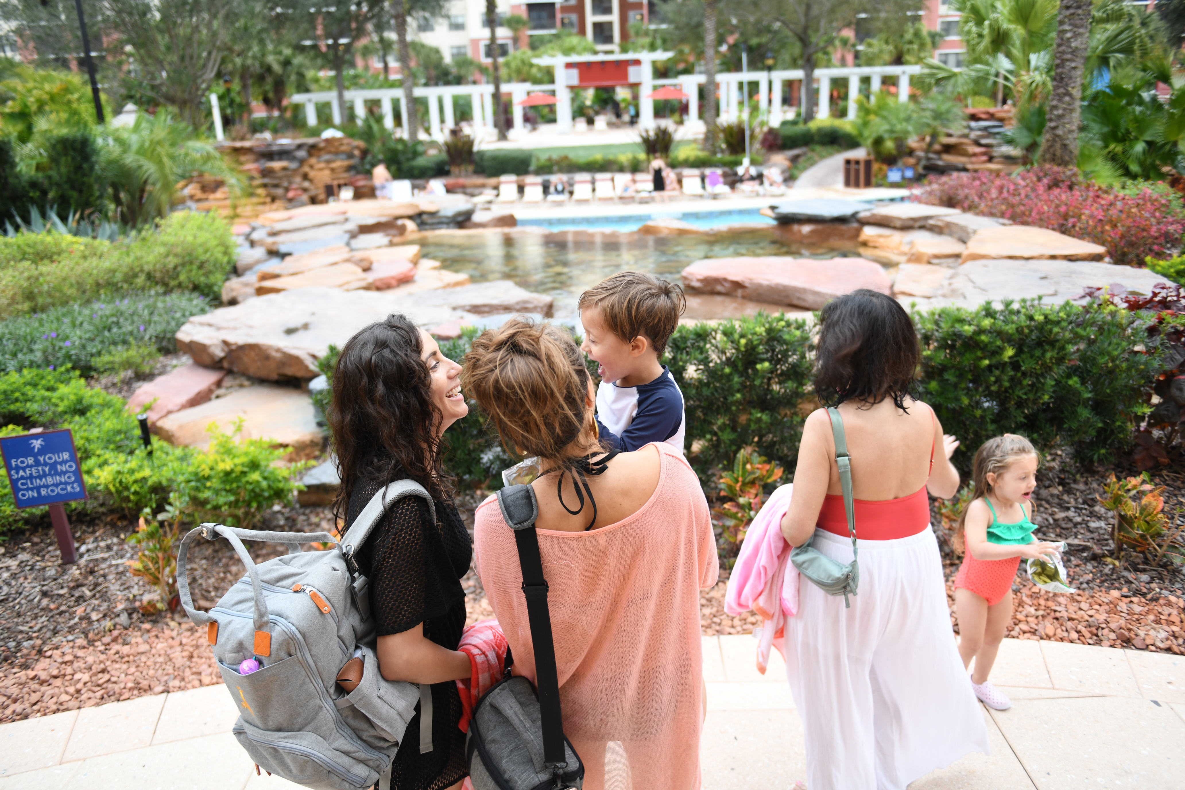 Raff and her family standing at the entrance of Orange Lake Resort.