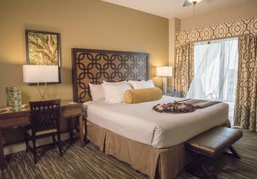 Bedroom with large window and a desk in a four bedroom Signature villa in River Island at Orange Lake Resort near Orlando, Florida