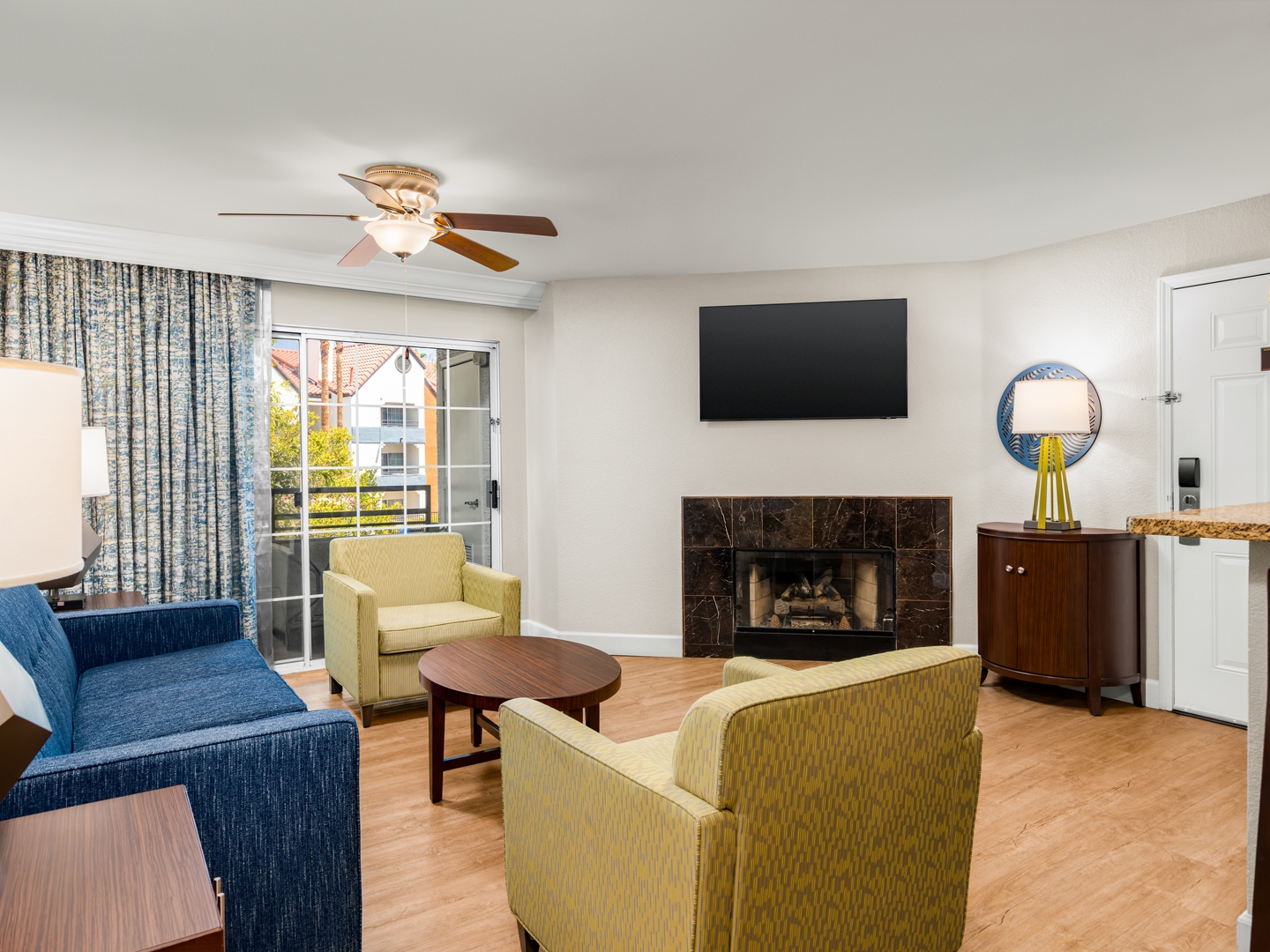 
Elegant living area with modern furnishings and a cozy fireplace.
