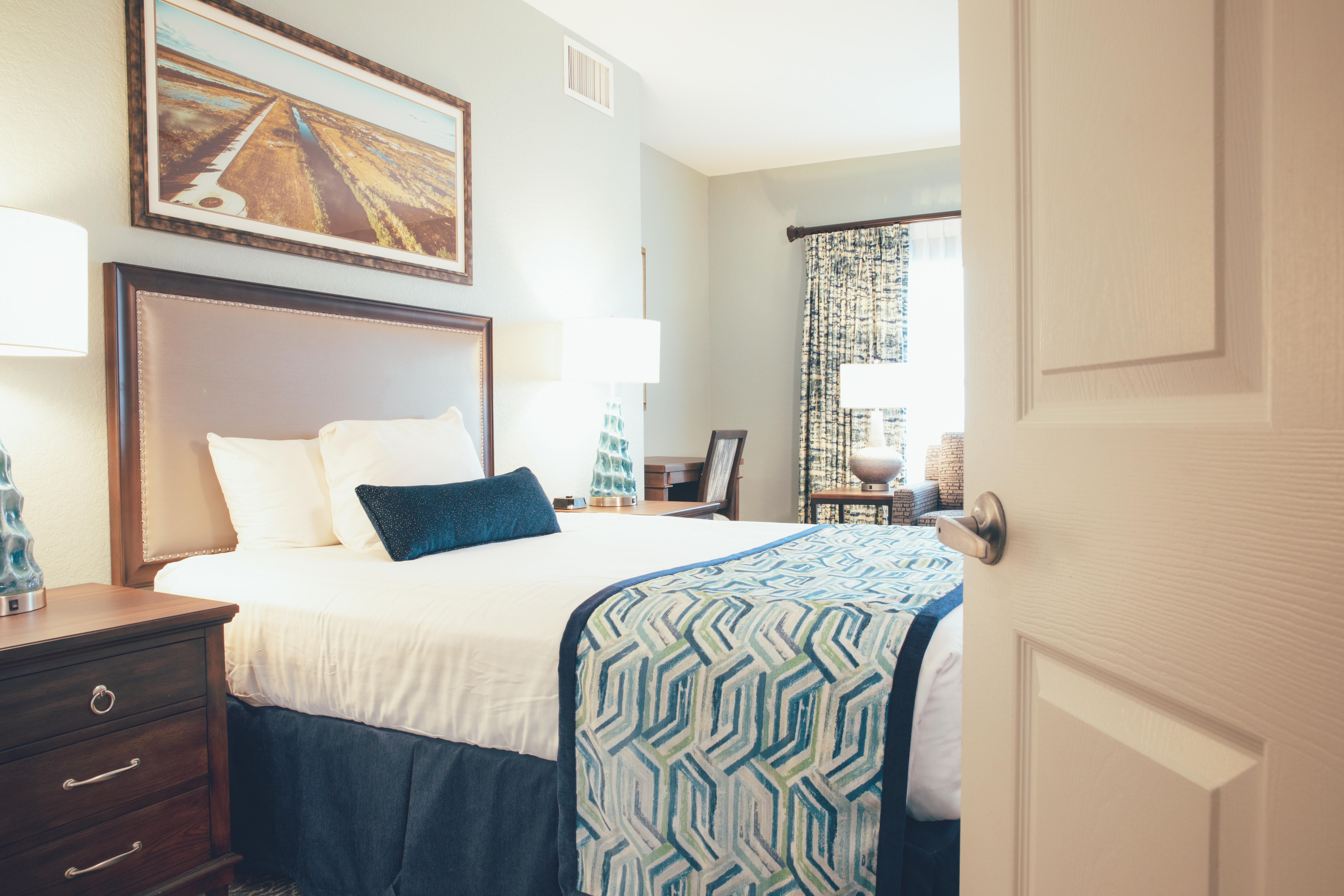 Bed with two nightstands in River Island at Orange Lake Resort near Orlando, Florida