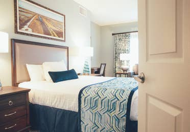 Bed with two nightstands in River Island at Orange Lake Resort near Orlando, Florida
