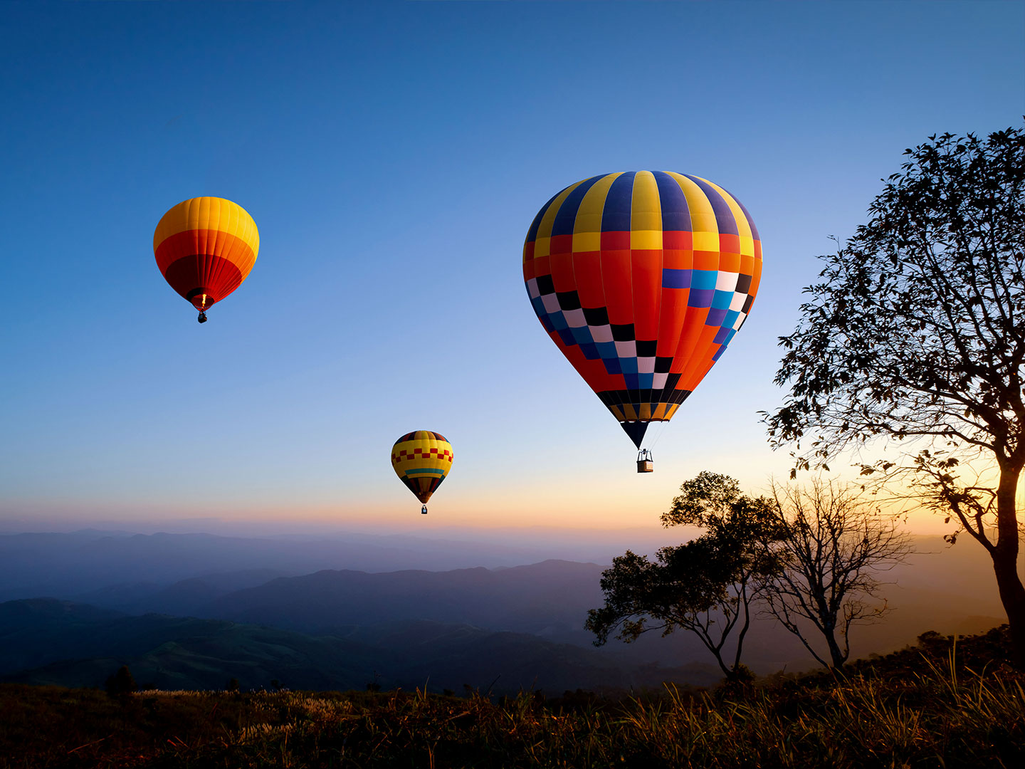 Three hot air balloons in the sky
