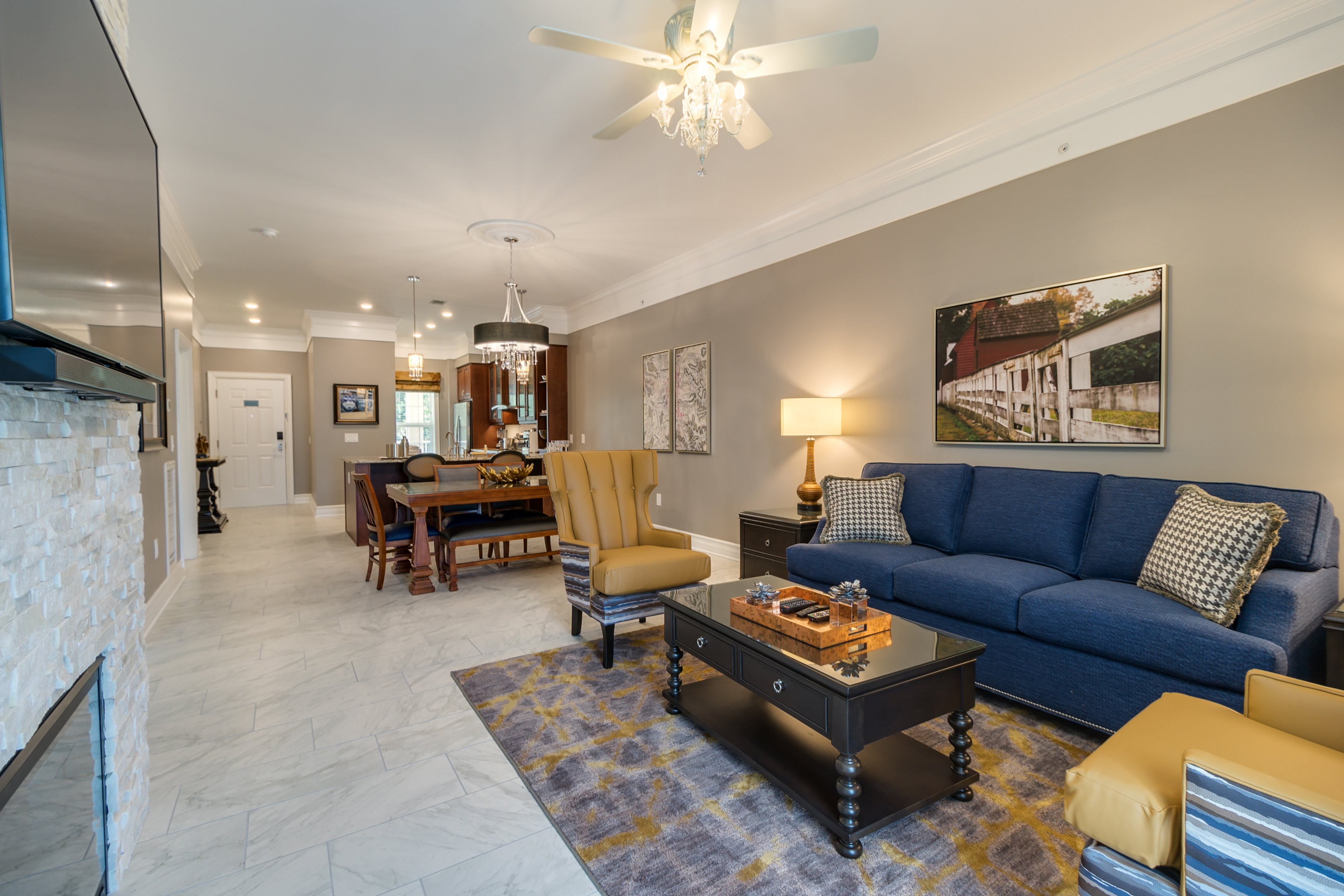 Living room and dining area in a Signature Collection villa at Williamsburg Resort.
