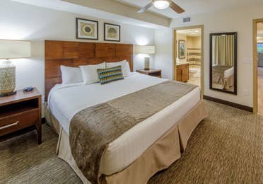 King bedroom with access to bathroom in a one-bedroom villa at Scottsdale Resort