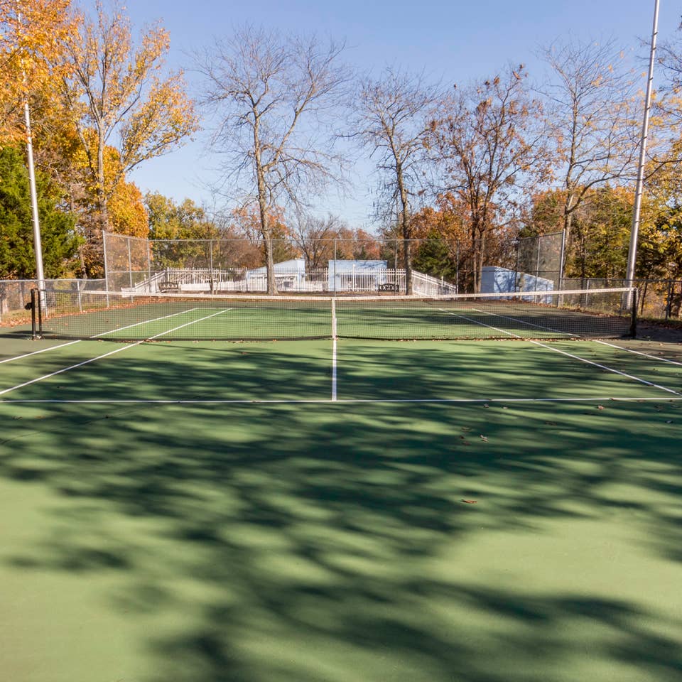 Outdoor tennis court at Ozark Mountain Resort in Kimberling City, Missouri.