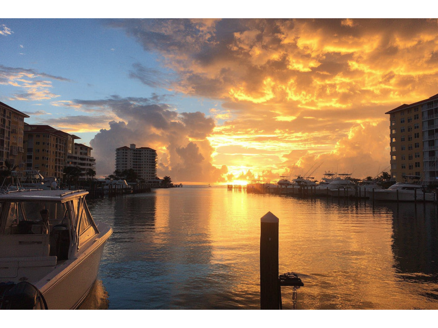 Sunset from the point-of-view of a dock in the bay.