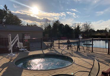 Outdoor hot tub beside pool at Apple Mountain Resort in Georgia.